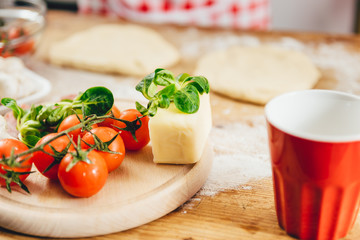 Woman preparing pizza