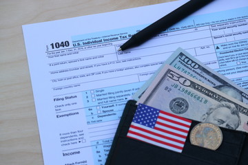 Tax form, Dollar cash in wallet, finance accounting and tax season concept