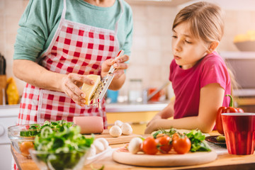 Mother and daughter preparing pizza