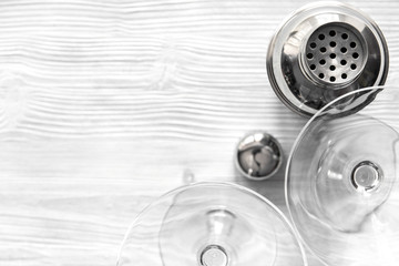 martini and shaker top view of wooden background