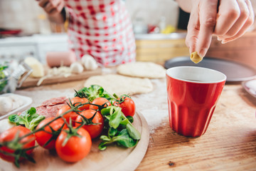 Woman preparing pizza