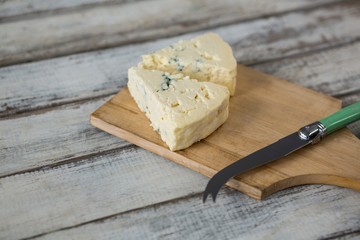 Slices of cheese with knife