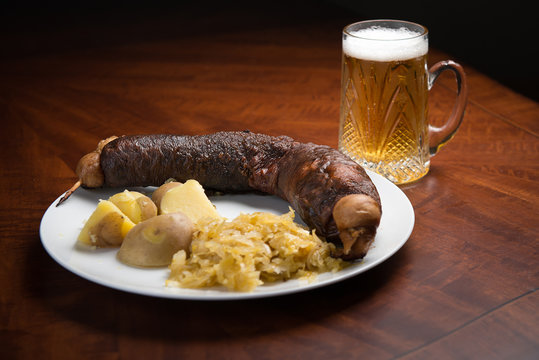 Pork blood sausage with potatoes, sauerkraut and beer