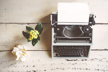 Vintage typewriter on  wooden background