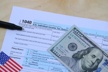 US tax form, dollar cash, pen, calculator, finance accounting and tax season concept