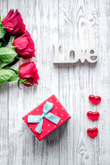 concept Valentine's Day with flower wooden background top view