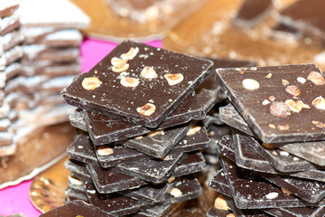 Pieces of chocolate with hazelnuts in streeet market