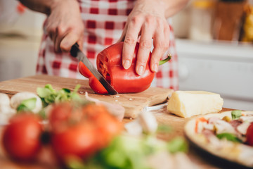 Woman slicing paprika