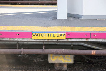 Fototapeta premium watch the gap sign posted on the platform