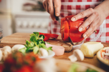 Woman slicing paprika