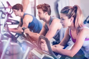 Fit people doing exercise bike