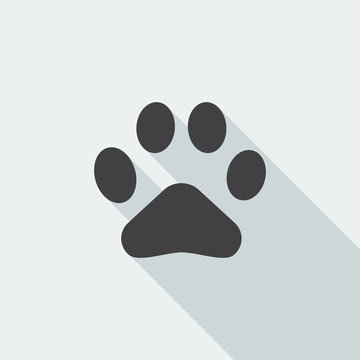 Black flat Paw Print icon with long shadow on white background