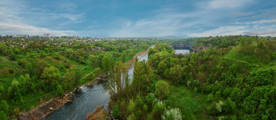 Obraz premium Panoramic view over a landscape of river and forest