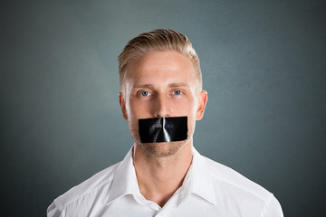 Man With Black Duct Tape Over His Mouth