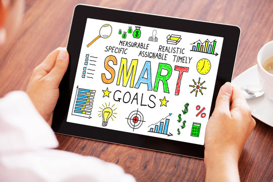 Businessperson Using Digital Tablet Showing Smart Goals Concept