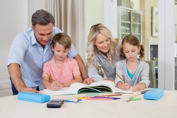 Parents assisting children doing homework