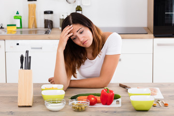 Obraz na płótnie Canvas Unhappy Woman In Kitchen
