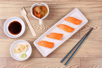 Fototapeta na wymiar Salmon sushi and side dish served with Japanese yellow curry.