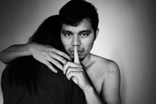 man arm around woman with insidious face