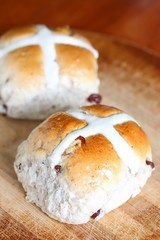 Hot Cross Bun on Wooden Cutting Board