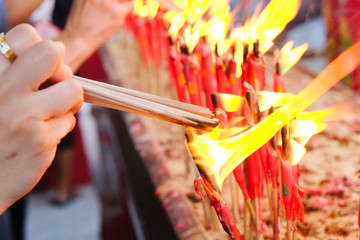 People light the candle at chinese temple