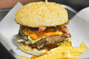 beef burger with cheese , sesame