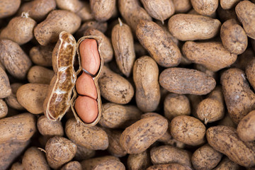 Raw peanuts in the shell background or texture. close up peanut