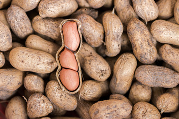 Raw peanuts in the shell background or texture. close up peanut