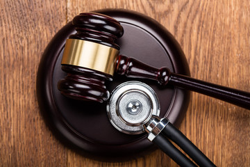 Brown Gavel With Medical Stethoscope