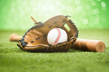 Baseball Equipment On Grassy Field