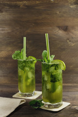 Mojito cocktails with mint leaves and lime