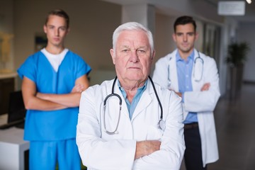 Portrait of doctors standing with arms crossed