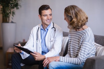 Doctor discussing a medical report with woman