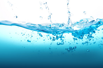 Close up blue Water splash with bubbles on white background