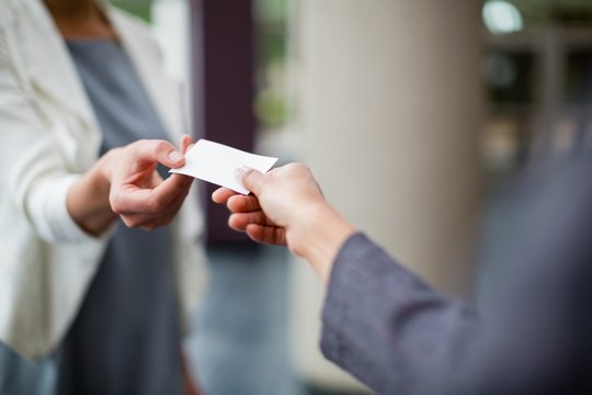 Business executives exchanging business card 
