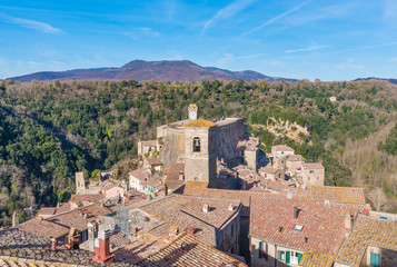 Fototapeta na wymiar Sorano (Italy) - An ancient medieval hill town hanging from a tuff stone in province of Grosseto, Tuscany region