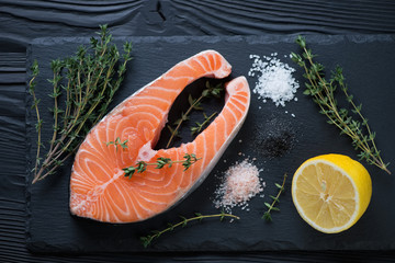 Above view of fresh uncooked salmon fillet with seasonings