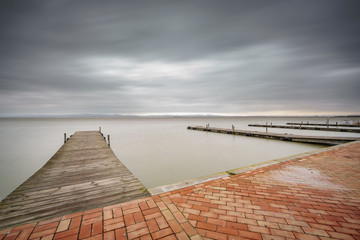 Storm over Albufera with pier, perspective, Valencia