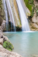 Fototapeta na wymiar Neda Waterfalls among the rocks and forest, Greece