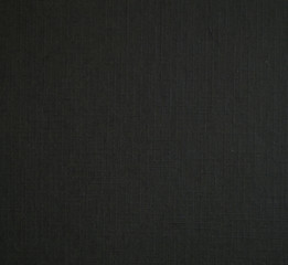 Black paper texture. Pressed paper close-up. Black paper closeup photo