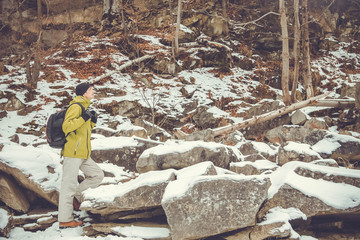 Man backpacker walking in mountains
