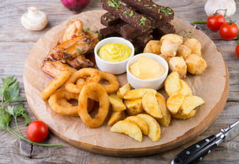 Beer snacks on wooden board