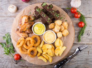 Beer snacks on wooden board