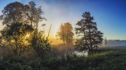 Beautiful misty dawn at the small river.