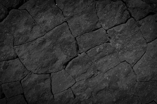 Dark grey black wall stone background or texture -lava texture