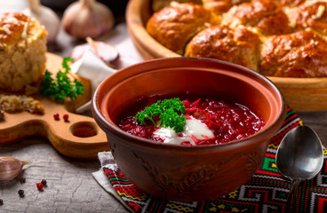 Ukrainian borsch and dumplings with garlic on the table