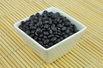 Black beans in white bowl