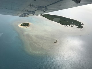 airport airplane kid children pilot co-pilot view barrier reef sea ocean water flight  scenic  cruise