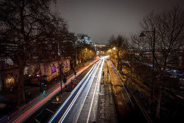 Fototapeta na wymiar Light car streaks as seen from the top of Golden Jubilee bridge at embankment station