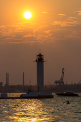 Fototapeta premium Lighthouse at sunset on the Black Sea